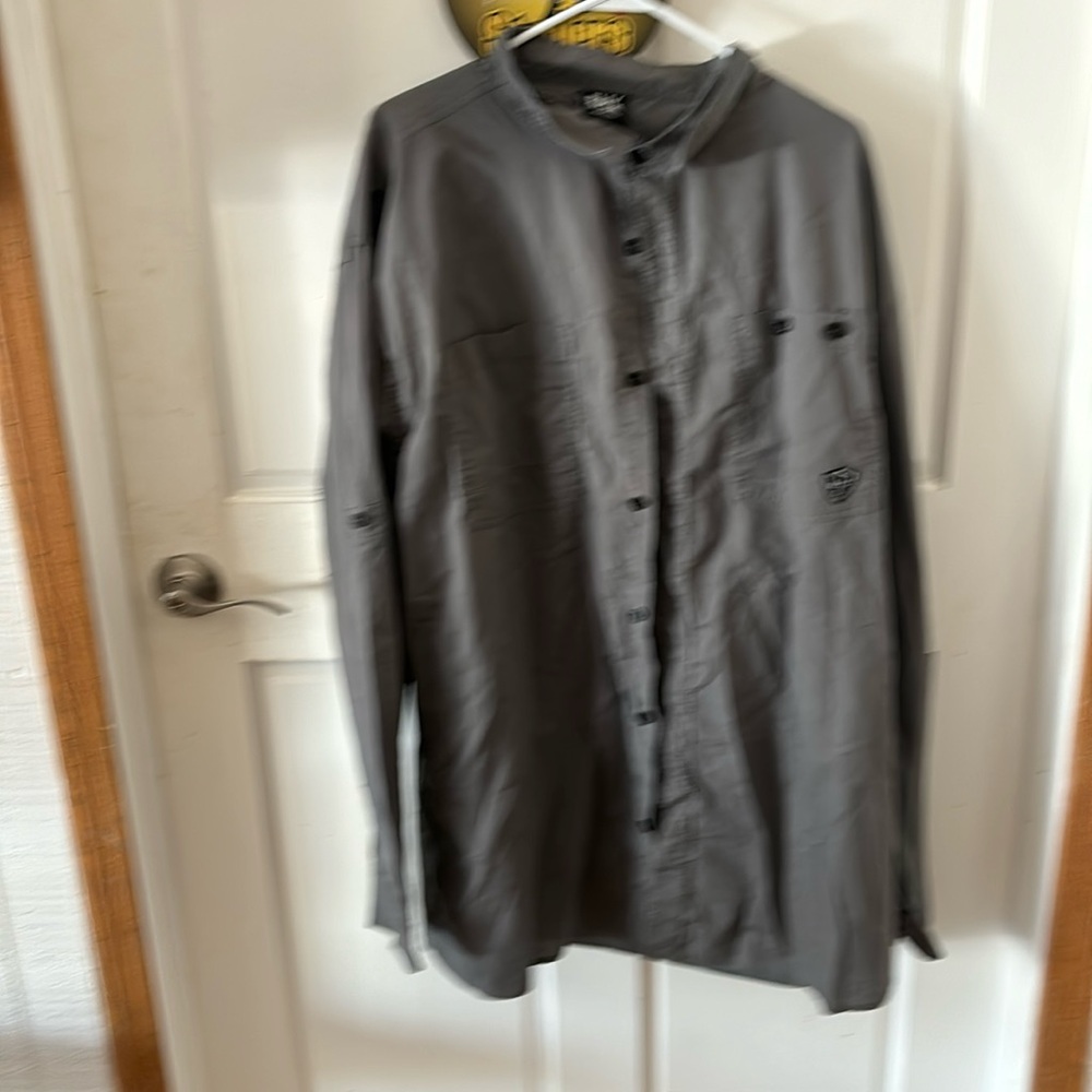 This shirt is a long-sleeved, grey-colored garment. 4xl